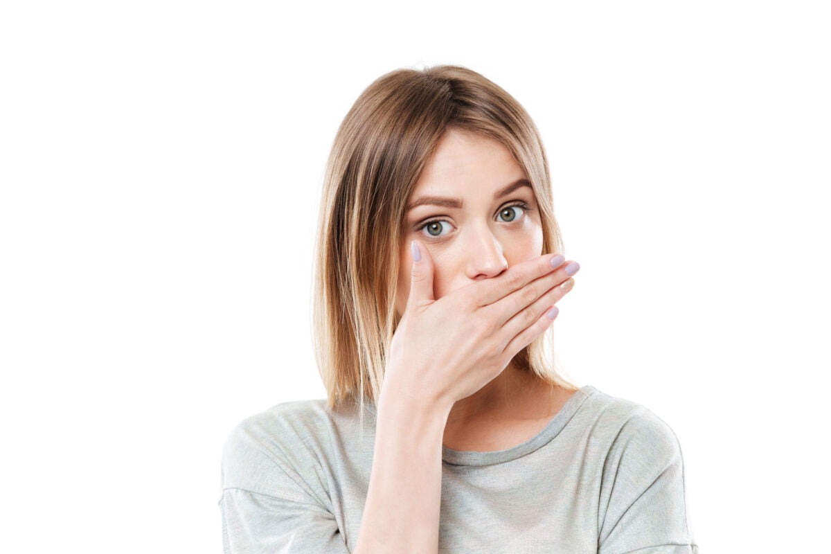 pretty-young-young-woman-covering-her-mouth-with-hand.jpg